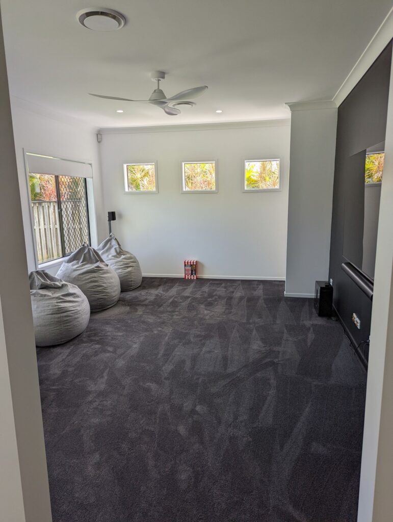 Carpeted lounge room after renovation, Carrara