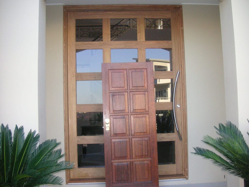 Before renovation: the original timber entry door, Varsity Lakes