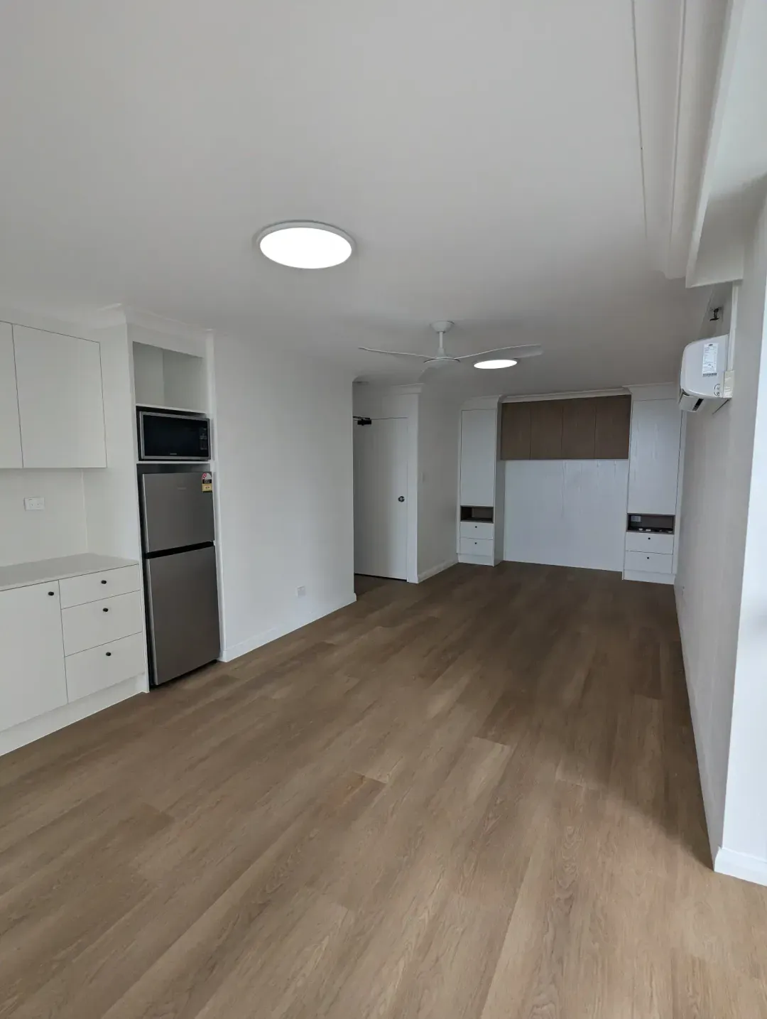 Renovated open-plan apartment kitchen and living area, Surfers Paradise