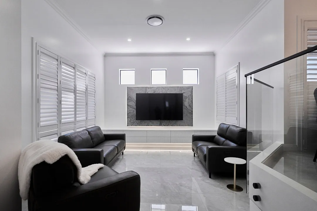 Renovated living room with marble feature wall, Varsity Lakes whole-home renovation