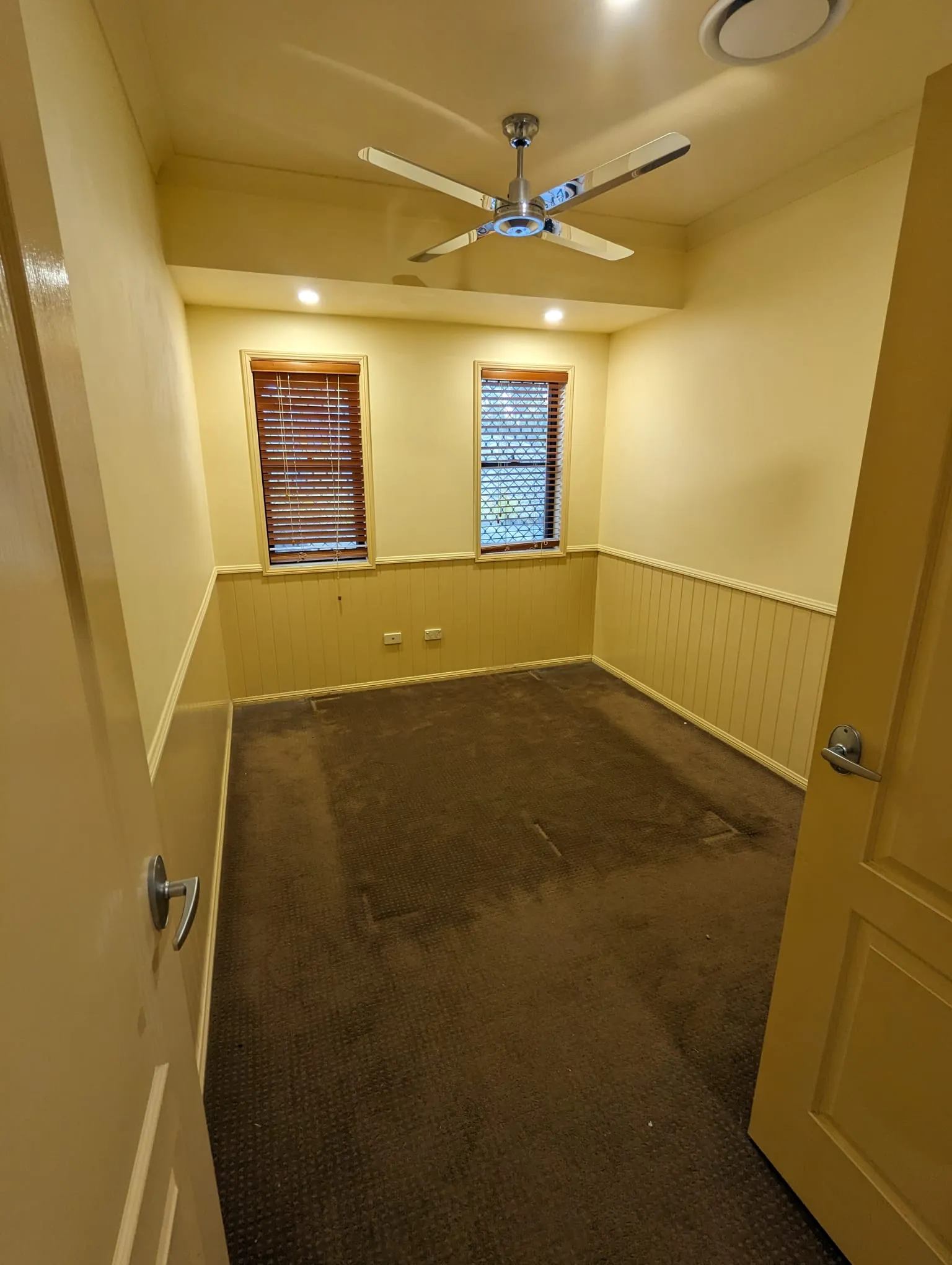 Before renovation: a bedroom with brown carpet before the renovation, Varsity Lakes