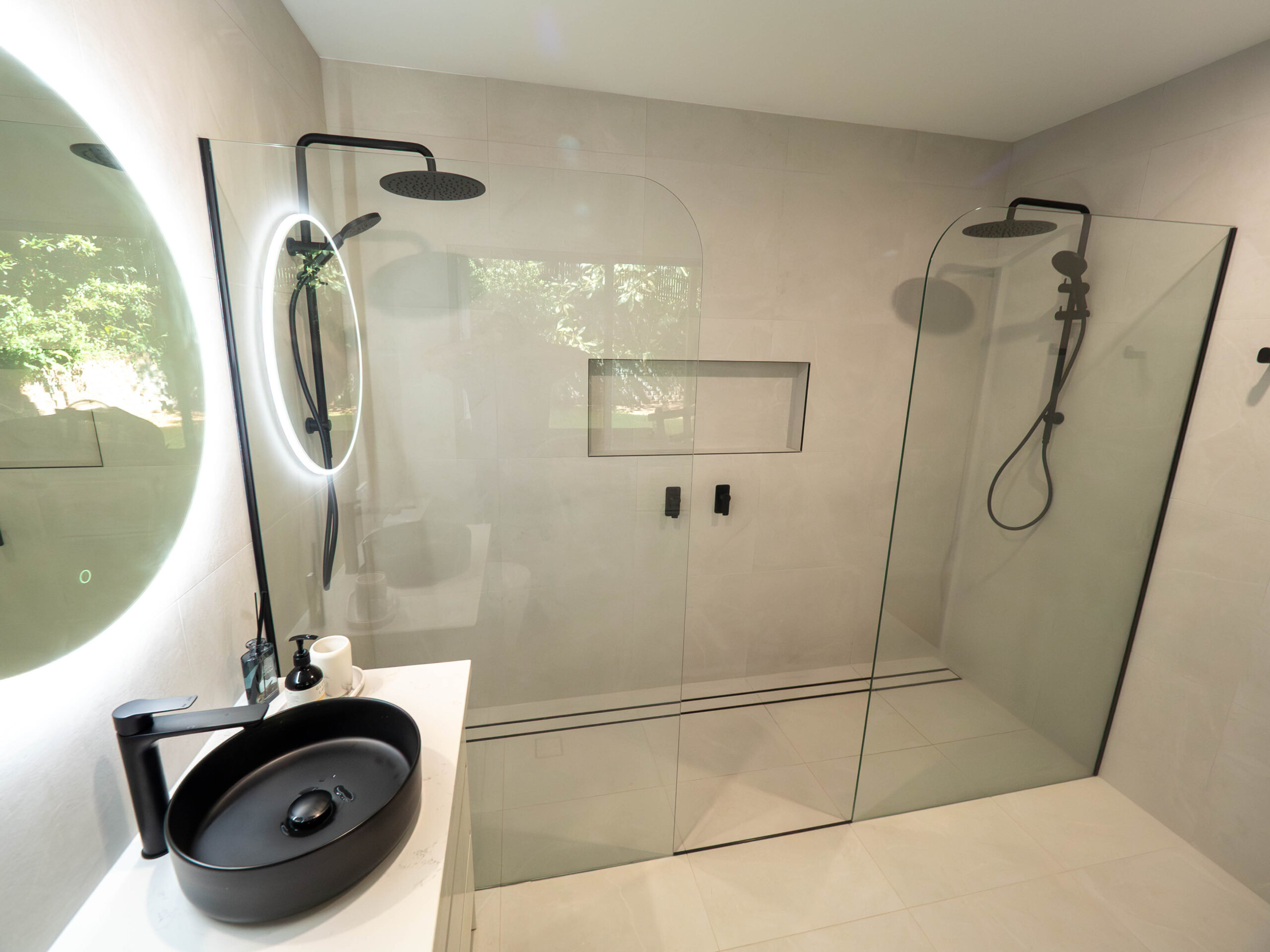 Walk-in double shower with black tapware and a tiled niche, Lower Beechmont