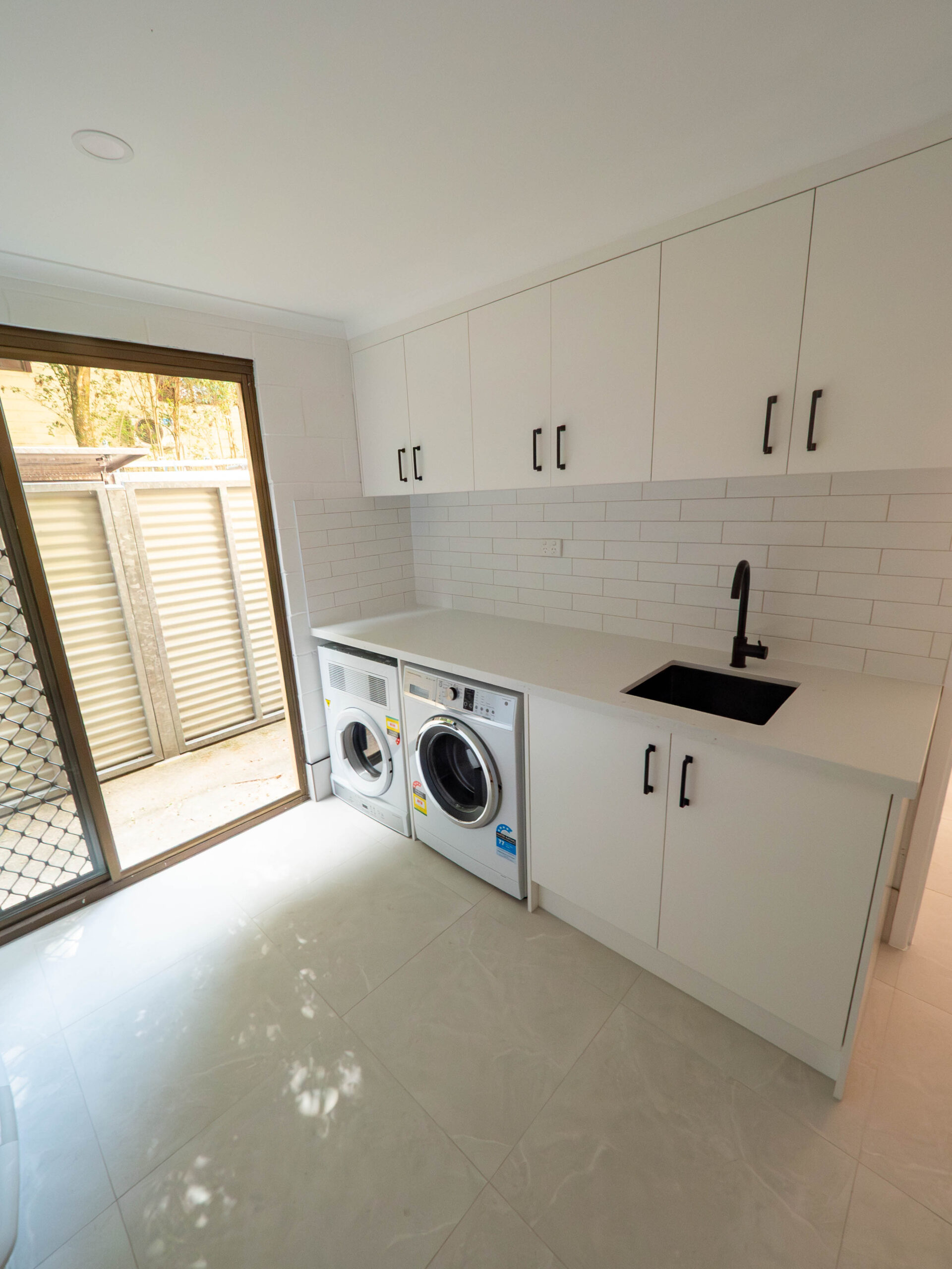 Renovated laundry with custom joinery and bench space, Gold Coast