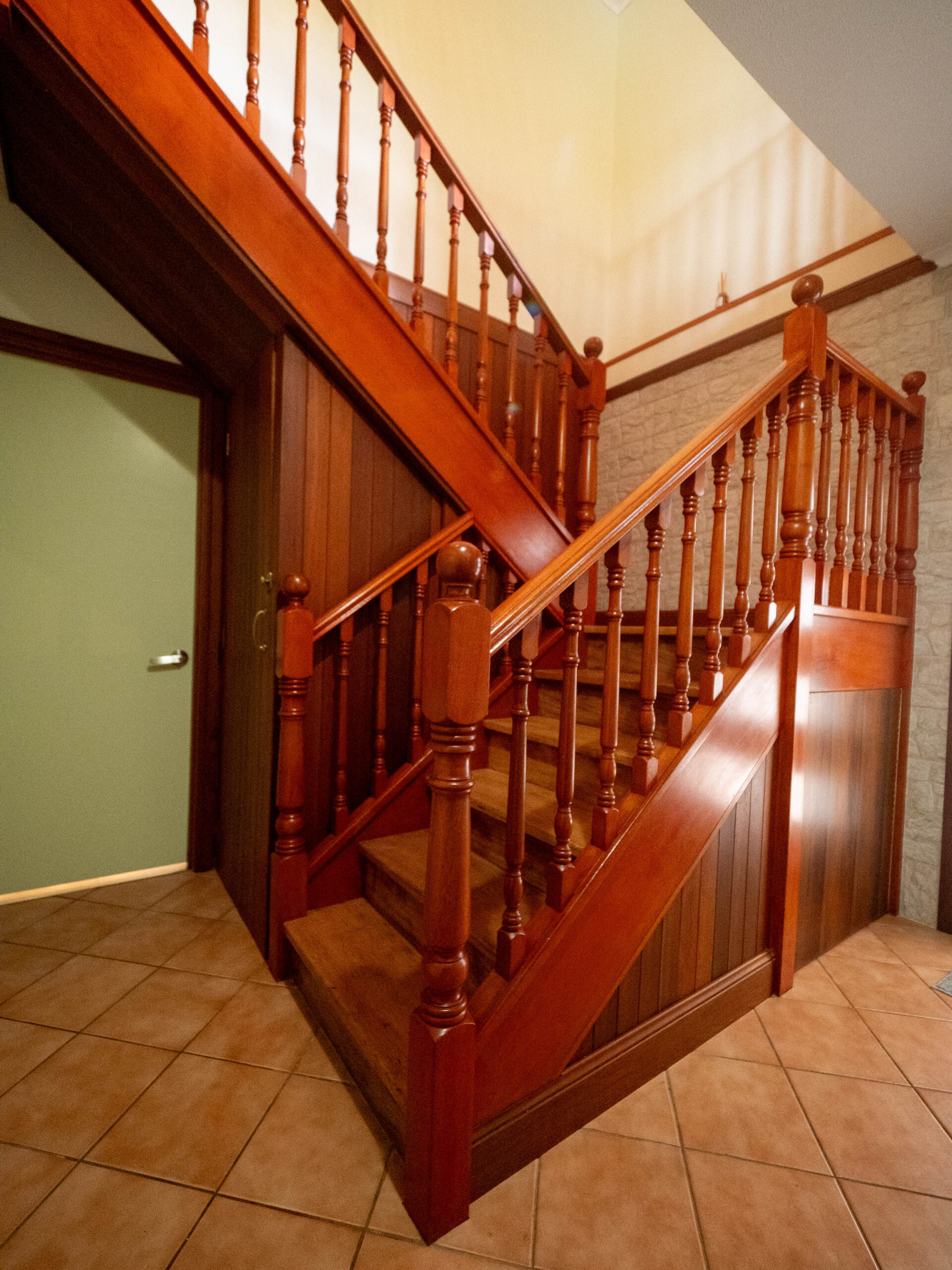 Before renovation: the original timber staircase with turned balusters, Lower Beechmont